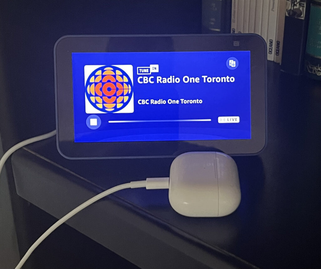 a photo of a modem with a blue screen sitting on a desk